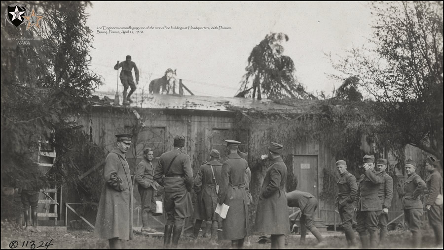 2nd Engineers camouflaging one of the new office buildings at Headquarters, 26th Division. Boucq, France, April 12, 1918.