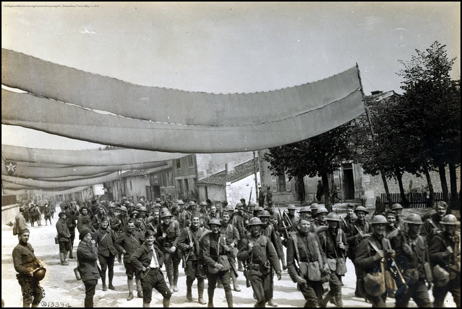 5th Regiment Marines returning from trenches passing thru Sommedieue, France. May 11, 1918.