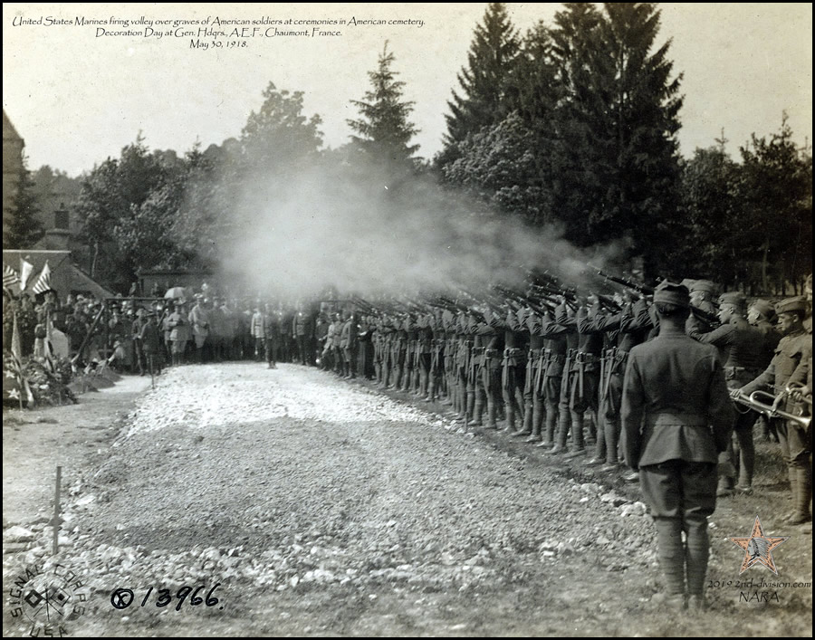 US MARINES firing over graves of American soldiers in cemetery. Decoration Day, GHQ., A.E.F., Chaumont, France. May 30, 1918.