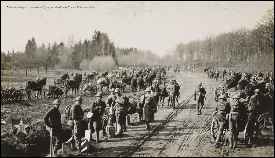 Marines resting en route to front. St. Ouen-les-Paray, France. February, 1918.