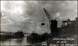 Unloading Barges at dusk at Engers, Germany