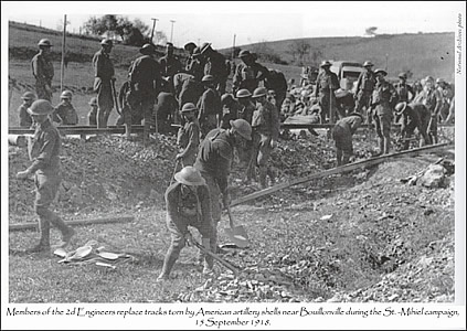 Members of the 2d Engineers replace tracks torn by American artillery shells near Bouillonville during the St. -Mihiel campaign, 15 September 1918.